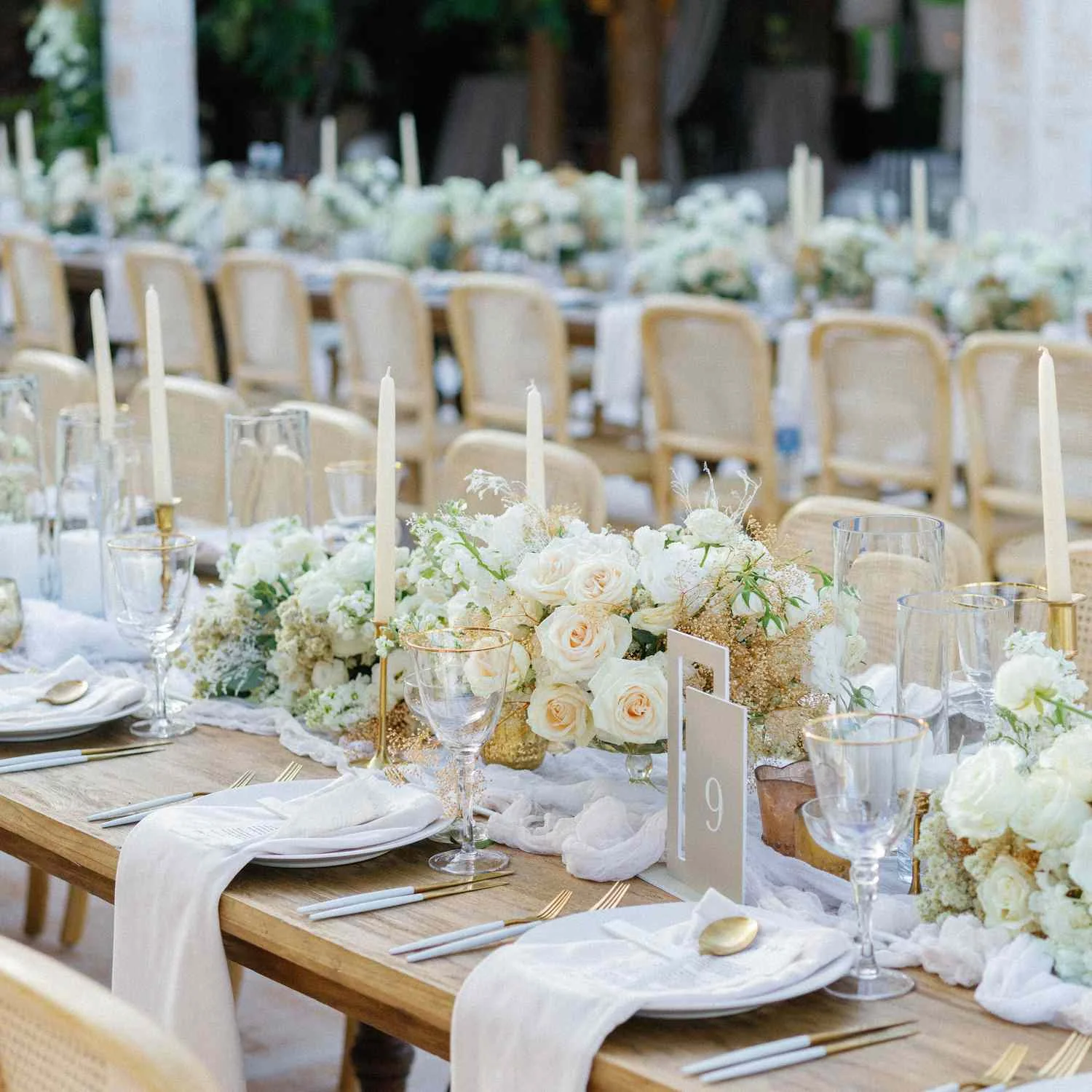 Elegant luxury wedding table setting with floral arrangements and candlelight